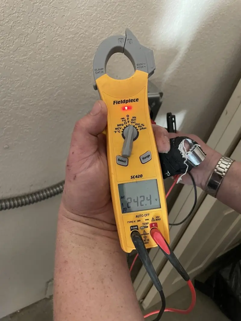 Voltage testing with clamp meter during Generator Installation in Keene